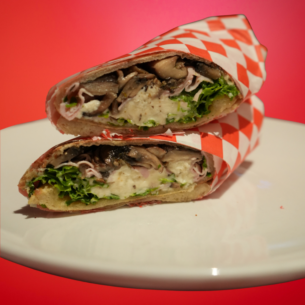 Cotto panuozzo on white plate with red background