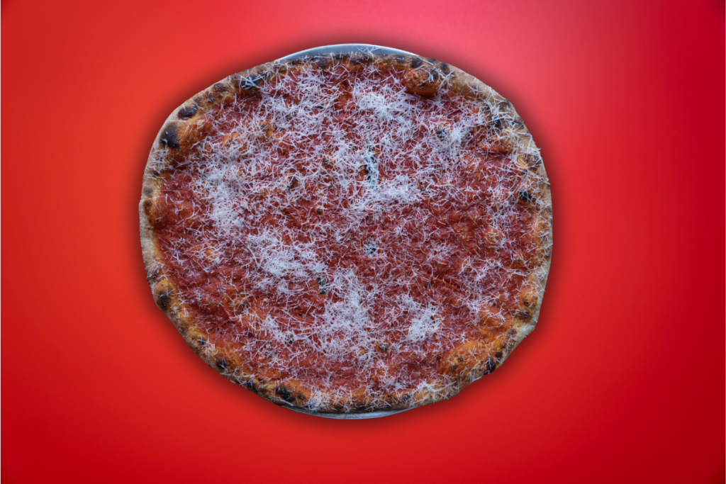 Double marinara and pecorino on New York style pizza with red background