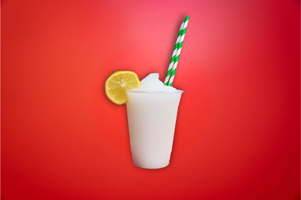 frozen margarita slushie on red background